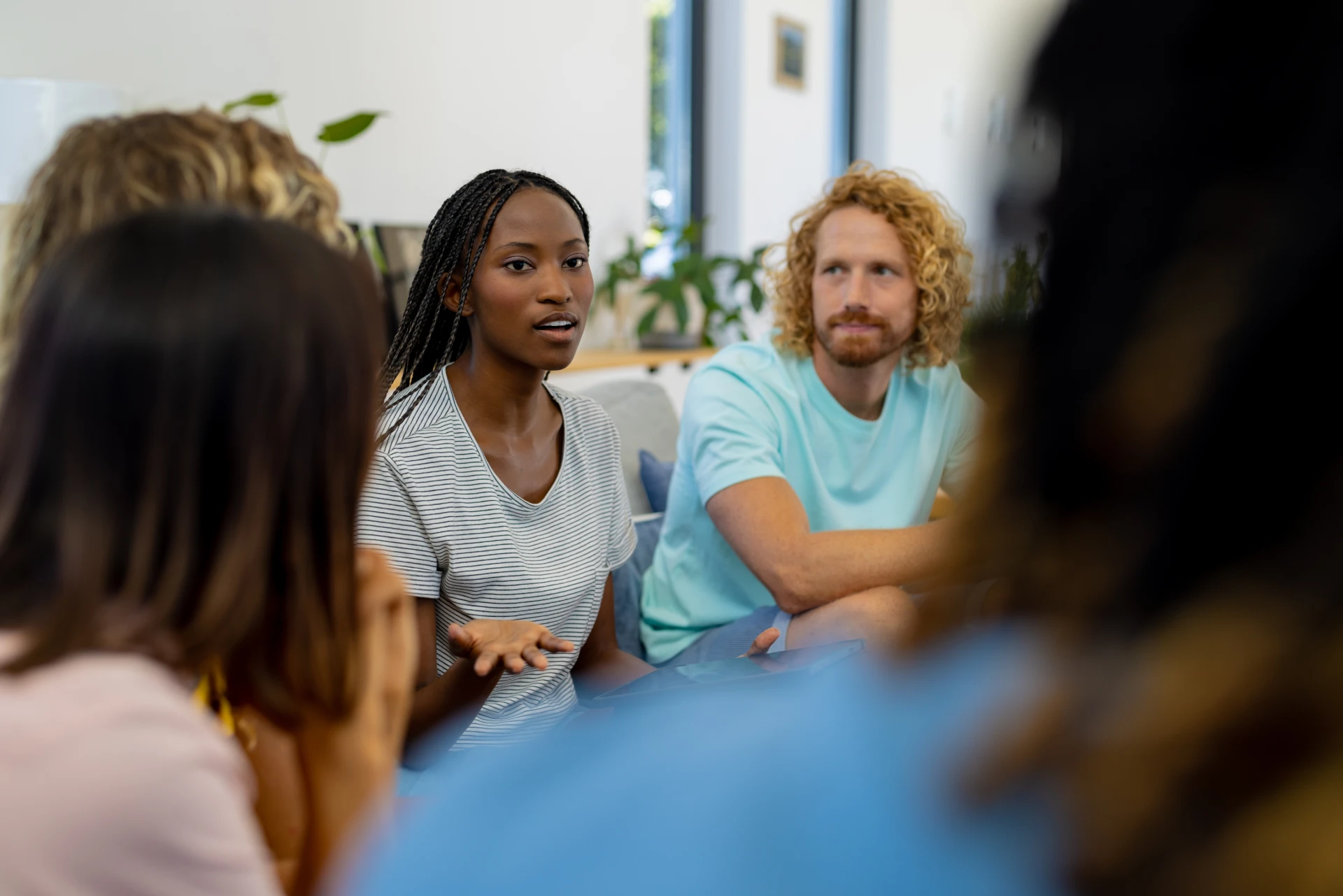 small-group-having-a-friendly-conversation-indoors